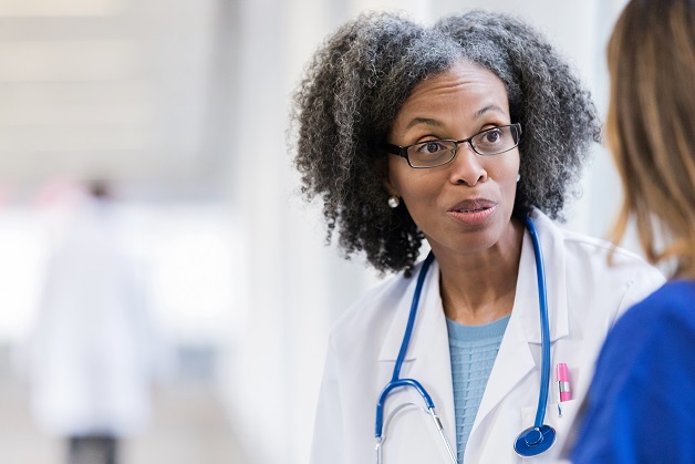 Doctor talking to woman